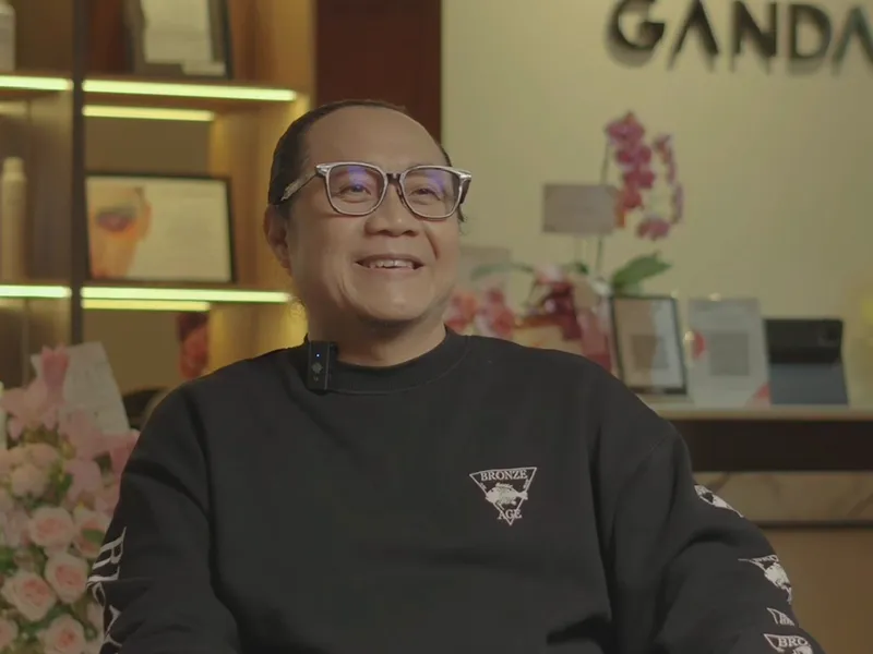 Ganda smiling in his studio